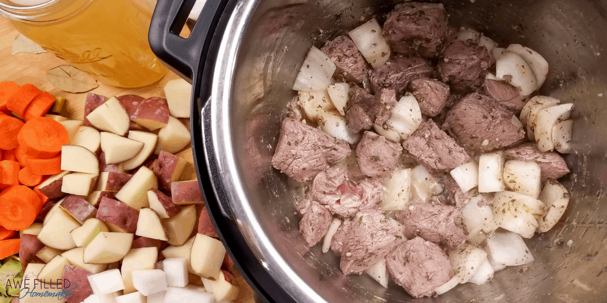 adding the lamb meat to the instant pot 