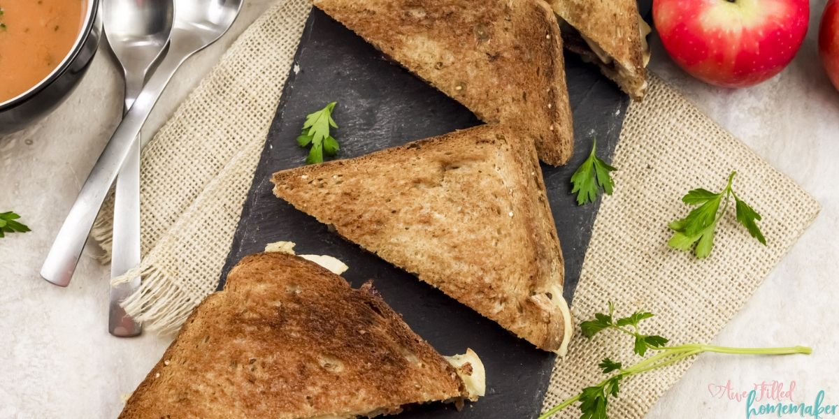 Spice up your lunch by making this Apple Gouda Grilled Cheese sandwich. Upgrade that commonly used American cheese for a delicious and rich gouda, covering slices of sweet apple, bacon, and pickles. All of this sandwiched between perfectly crisped bread to make the ideal sandwich to welcome in Autumn. Although it's delicious year-round, it truly is the perfect Autumn lunch.
