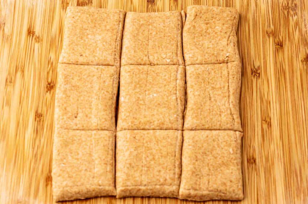 cutting the dough into squares 