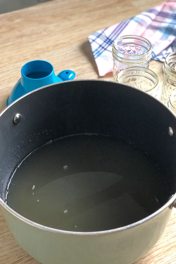 stirring the liquid on the stove 