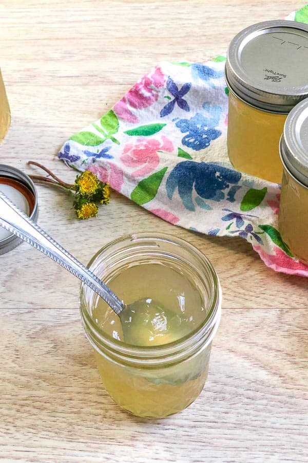 spoon dipping into dandelion jelly 