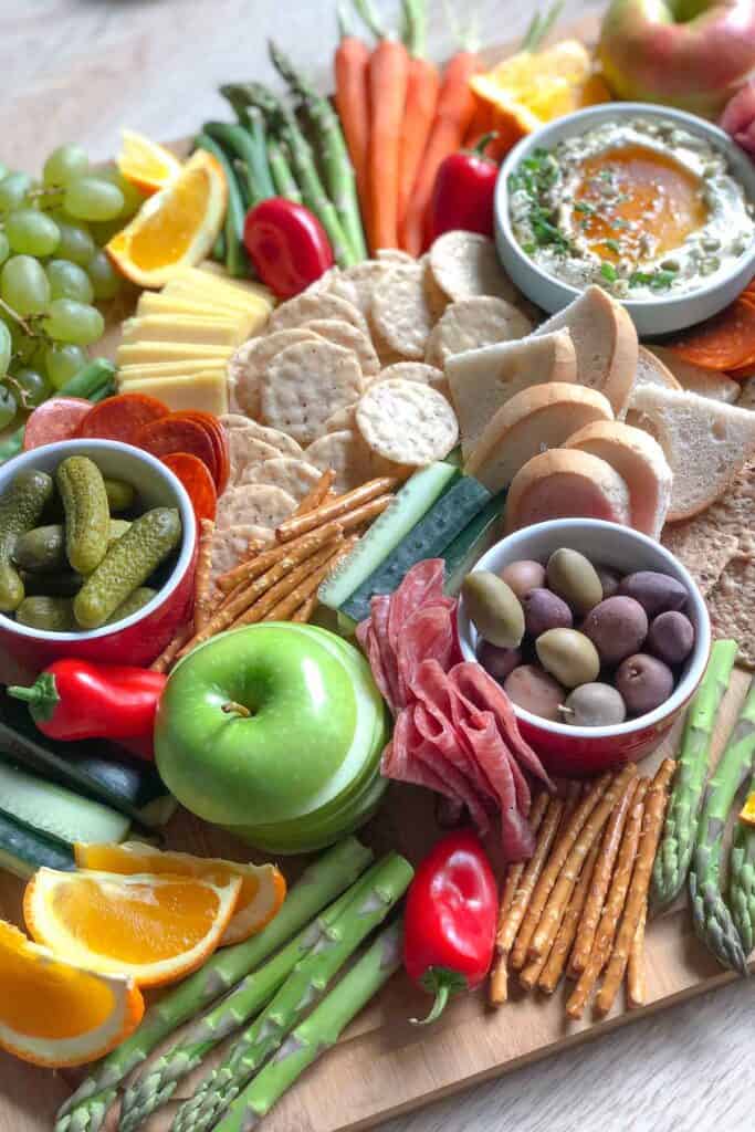 adding meat to a charcuterie board