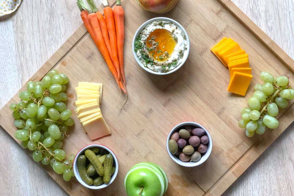 adding dips to a charcuterie board 