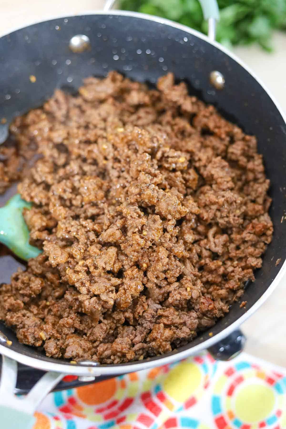 browning the ground beef on the stove 